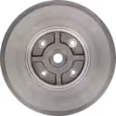 Composant métallique circulaire de turbocompresseur avec bossage central usiné