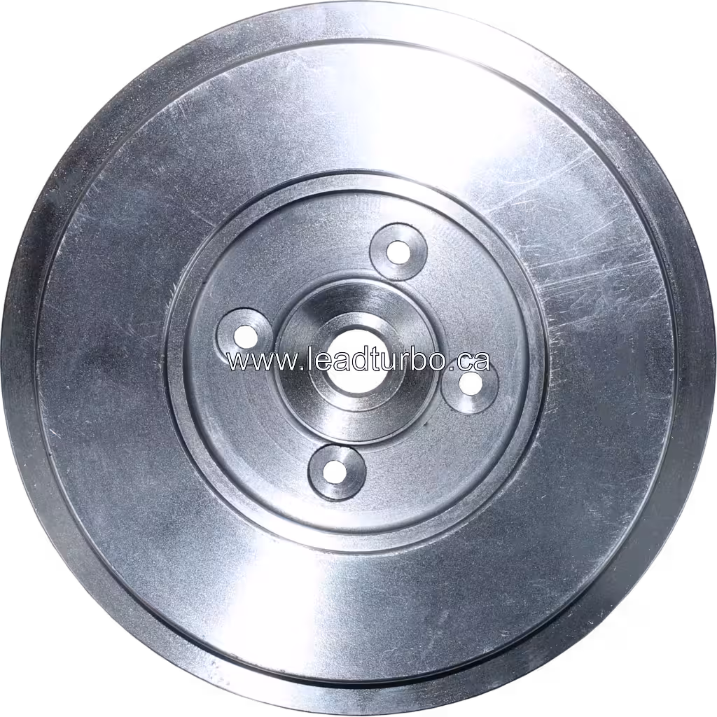Machined metal back plate with four mounting holes for CAT Earth Moving