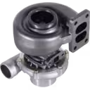 Bottom view of H1C turbocharger unit with central bearing housing and turbine outlet