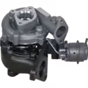 Top 45-degree view of Nissan YD22ED turbocharger with visible actuator and mounting flanges