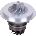 Top view of J96 turbo core with silver compressor wheel and mounting flange